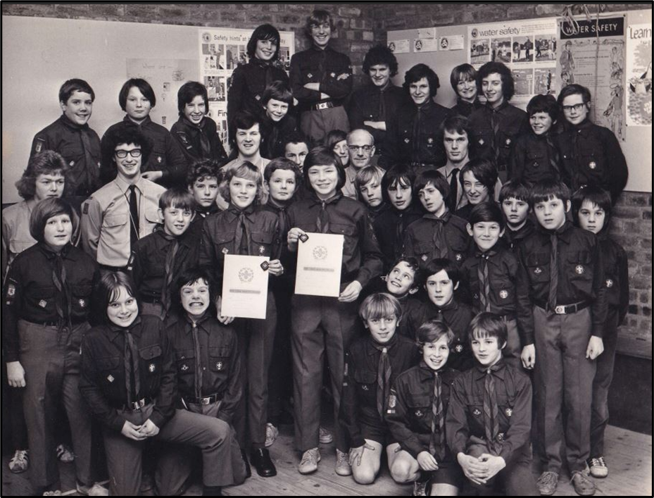 Group of scouts in a hall posing for a picture