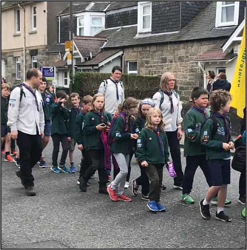 Scouts walking in a parade