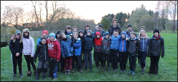 Group of young people outside posing for photo